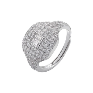 Macro detail of silver square cut zirconia ring with micro-pave setting on an open band