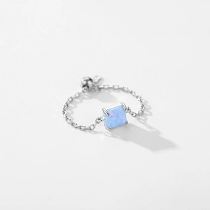 Minimalist S925 sterling silver chain ring with square blue opal on a white background