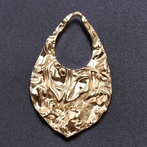 Detailed view of golden 304 stainless steel hammered teardrop hollow pendant charm
