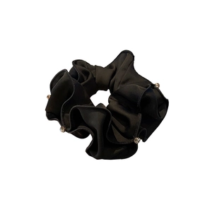 Minimalist black satin scrunchie with sparkling rhinestones for ponytail styling