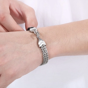 Detail shot of men's stainless steel fish scale bracelet with a unique hook clasp closure