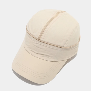 Detail view of the zipper design on the quick-drying fabric of the beige baseball cap