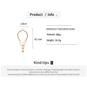 Detailed size specifications for gold layered heart sweater necklace in alloy metal