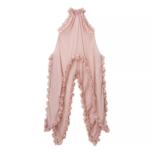 Close-up of pink chiffon romper featuring delicate ruffle edges and halter neckline