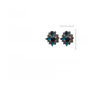 Macro shot of vintage flower stud earrings with dimensions 2.8cm by 2.5cm