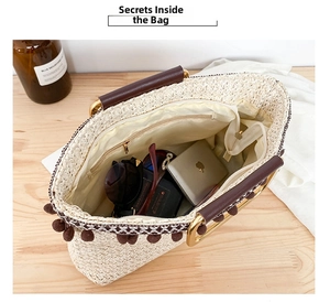 Internal view of straw handbag showing large capacity for sunglasses and phone
