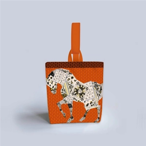 Detail of artistic horse collage print on premium orange canvas tote bag surface