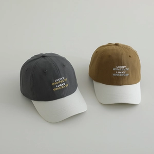 Kids colorblock baseball caps featuring Lucky Whatever embroidery in grey and yellow