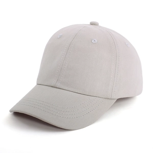 Detail view of grey kids baseball cap showing six-panel structure and curved brim stitching