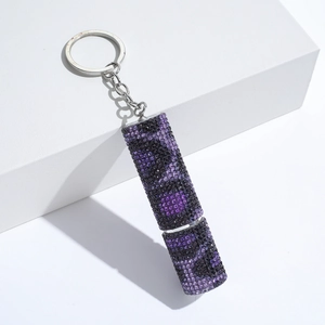 Detail of leopard print rhinestone keychain pendant in purple and black crystals