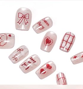 Pink cat eye press-on nails featuring cute puppies, red hearts and plaid bow designs