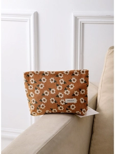 Vintage corduroy makeup bag with floral pattern and H&R logo in warm orange brown