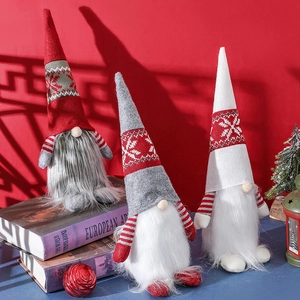 Three Nordic Christmas gnomes set in red, white and grey on books with festive background