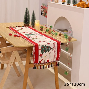Detailed view of Chenille Christmas table runner with snowman print and fringe, 35x120cm