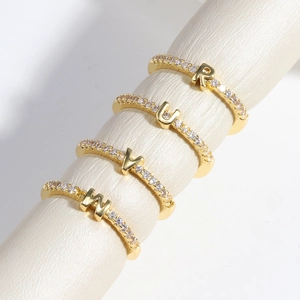 Adjustable 18k gold plated brass rings with diamond-studded letters R, U, V, and M