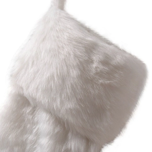 Close-up of white faux fur material on top of Christmas stocking decoration