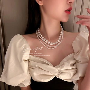 Elegant multi-layer white pearl necklace with four strands of varying sizes for women