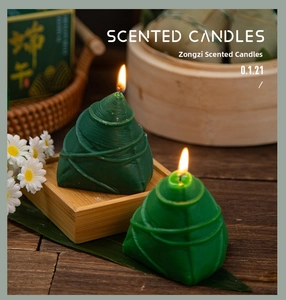 Macro detail of Zongzi shaped scented candle with realistic leaf texture and bamboo tray