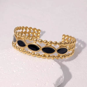 Bracelet jonc ouvert vintage en acier doré 18 carats avec détail émail noir ovale