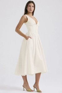 Detailed view of deep V-neck and slim waist design on the cream white long summer dress