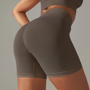 Detail of seamless dark gray high-waisted shorts with ribbed waistband and scrunch butt effect