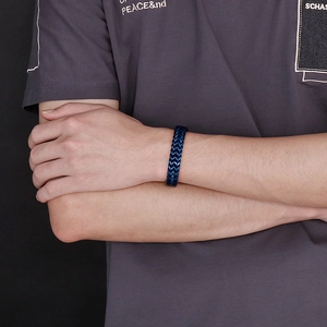 Close-up of blue woven keel chain bracelet on male wrist with rock hip-hop style
