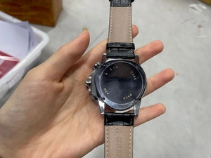 Macro view of automatic mechanical watch case back with genuine leather strap details
