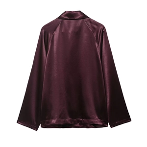 Back view of a sleek deep wine red satin long sleeve baseball jacket with a silky finish