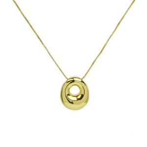 Macro shot of 18K gold puffed initial letter pendant on a minimalist steel chain necklace