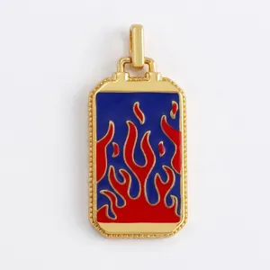 Macro detail of rectangle copper tarot pendant with red and blue enamel fire pattern