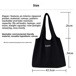 Detail view of large canvas tote bag showing dimensions and spacious interior capacity