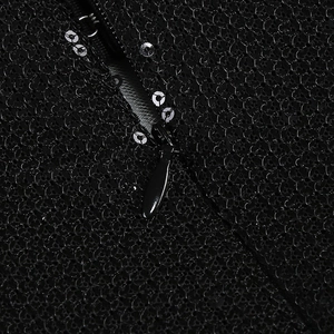 Detail of hidden zipper on black sequin dress with premium embroidery textures