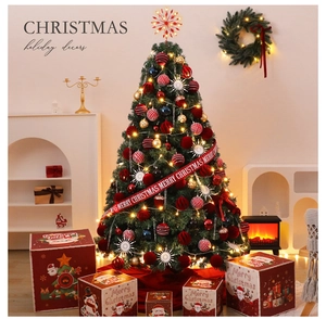Detailed view of decorated Christmas tree with red ribbons and festive gift boxes