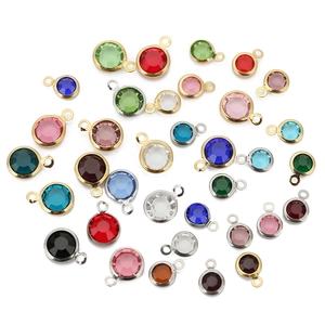 Macro shot of 8mm colorful round zircon pendants with gold and silver metal frames