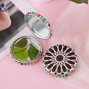 Portable folding makeup mirror with bohemian geometric pattern and double-sided view