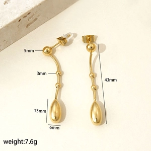 Detailed view of long gold tassel earrings with precise dimensions and weight specs