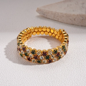 Luxury gold-plated triple-row bangle with vibrant red, green, and white crystals