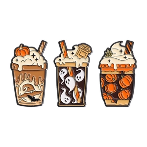 Halloween enamel pin set featuring three orange pumpkin juice drinks with ghost and bat details