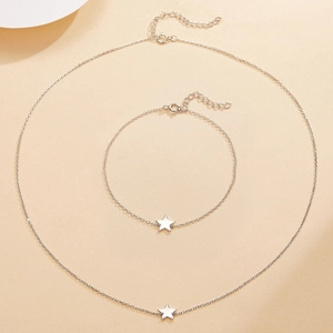 Detailed view of S925 silver star necklace and bracelet set on a beige background