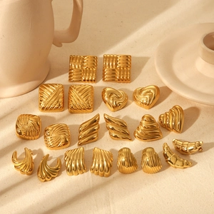 Set of gold textured geometric titanium steel earrings in various retro fashion shapes