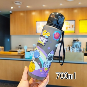 Detail of 700ml space themed astronaut water bottle with handle in a matte grey finish