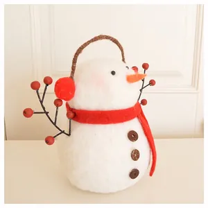 Handmade wool felt snowman figurine with red scarf and earmuffs Christmas decoration