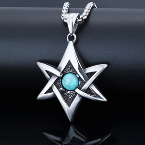 Macro detail of Viking Hexagram pendant with turquoise stone inlay on a silver chain