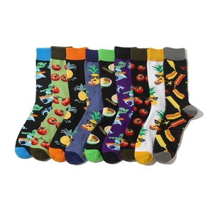 Detail of nine-pack cotton socks featuring colorful cartoon tomato and fruit patterns