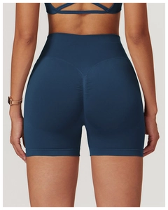 Detail view of seamless high-waist yoga shorts in navy blue with scrunch butt lifting texture