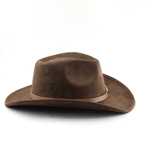 Detailed macro view of dark brown suede cowboy hat with a leather belt trim and retro texture
