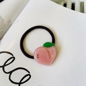 Y2K style pink acetate peach hair tie with green leaf and sparkling rhinestones