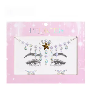 Detailed arrangement of iridescent star and teardrop rhinestones with small pearls on pink card