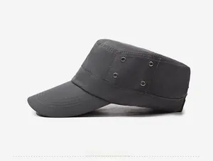 Detail of dark grey flat top cap showing four metal eyelets and reinforced stitching