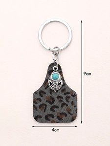 Vintage leopard print leather keychain with turquoise metal decor and 9cm size scale
